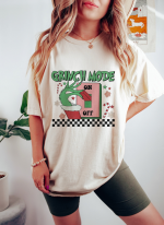 Get Festive with our Trendy Grinch Design Shirt: Perfect for Grinchmas and Retro Christmas Celebrations!