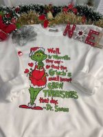 Cozy up in style with the Grinch Small Heart Sweatshirt – perfect for the holidays!