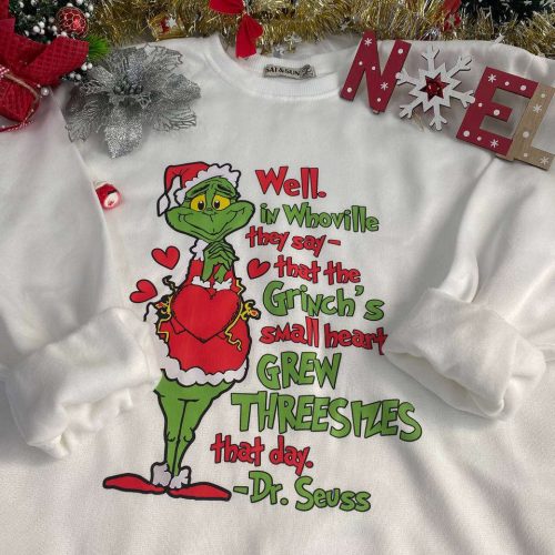 Cozy up in style with the Grinch Small Heart Sweatshirt – perfect for the holidays!